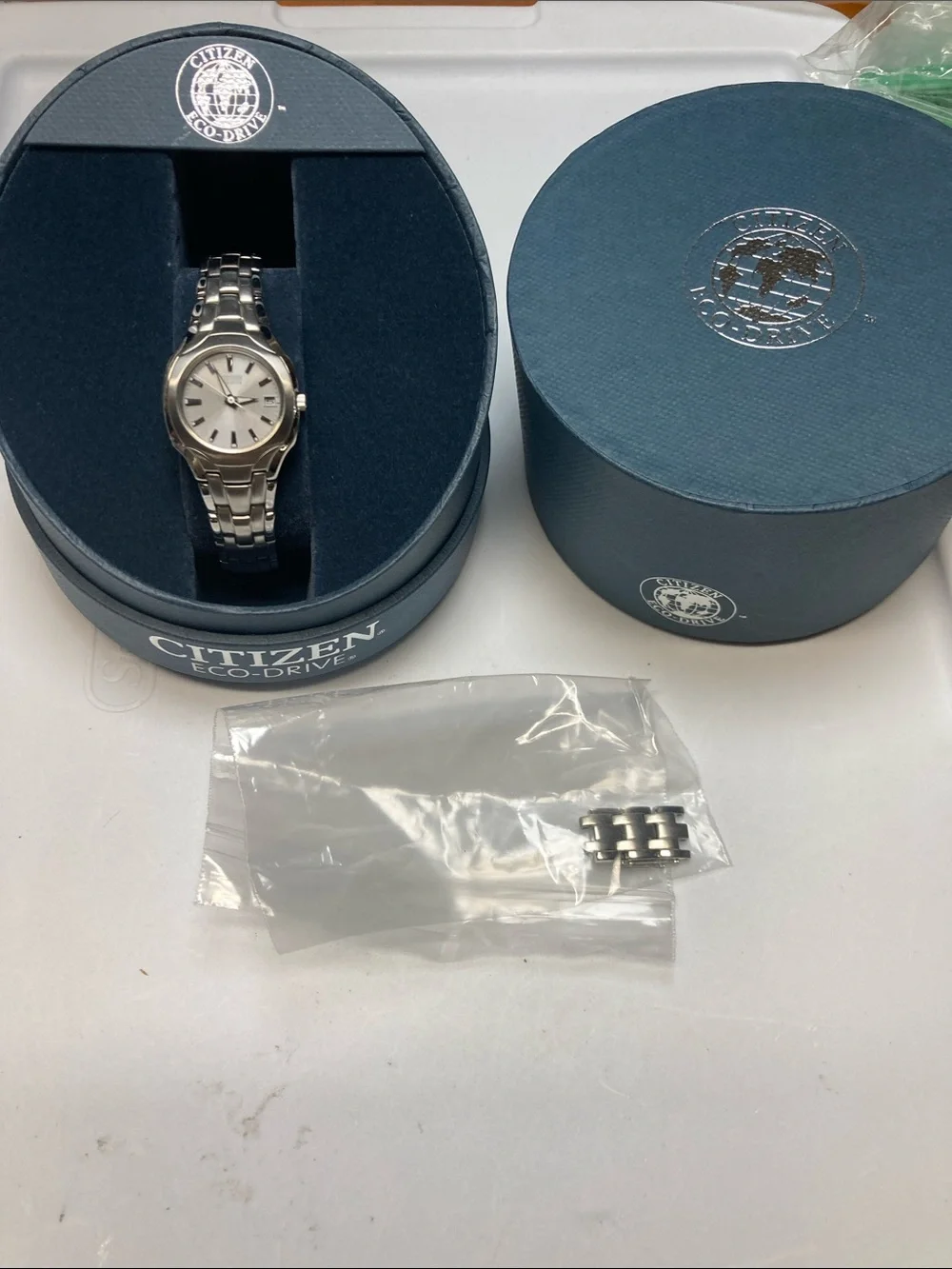 Citizen E011-S049601, Silver dial, Stainless eco drive Watch, with box